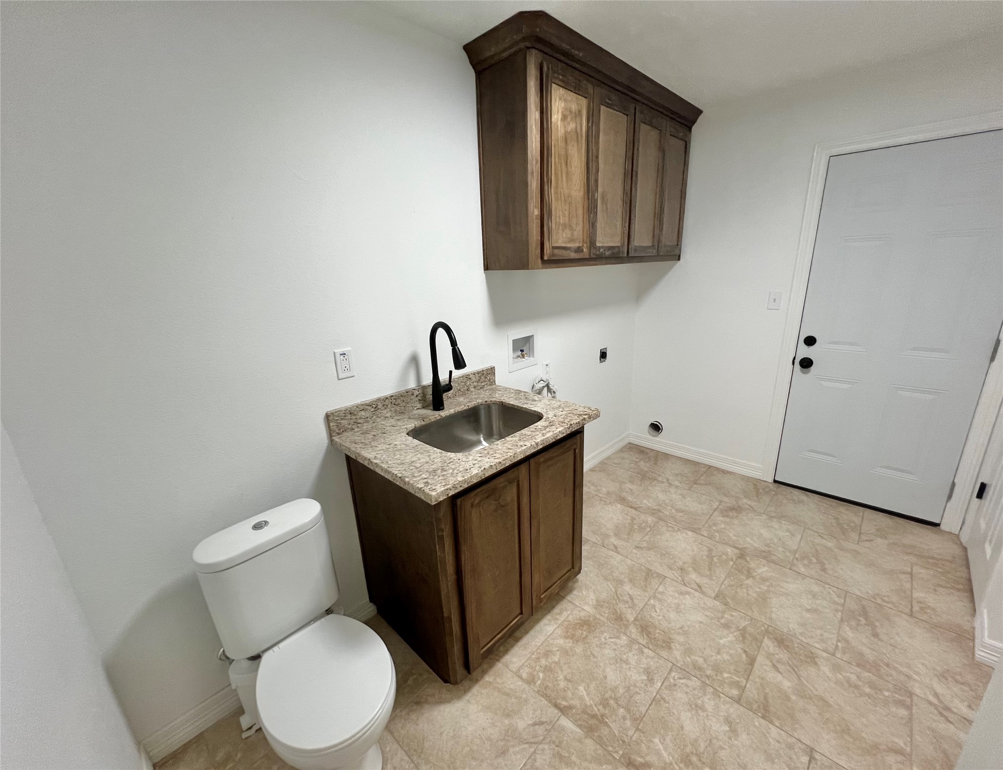 5 Colony Drive Angleton, TX 77515 - Photo 25 of 34 a bathroom with a toilet sink and mirror