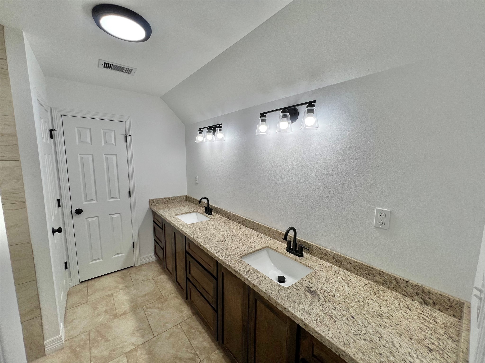 5 Colony Drive Angleton, TX 77515 - Photo 28 of 34 a bathroom with a granite countertop double vanity sink and mirror