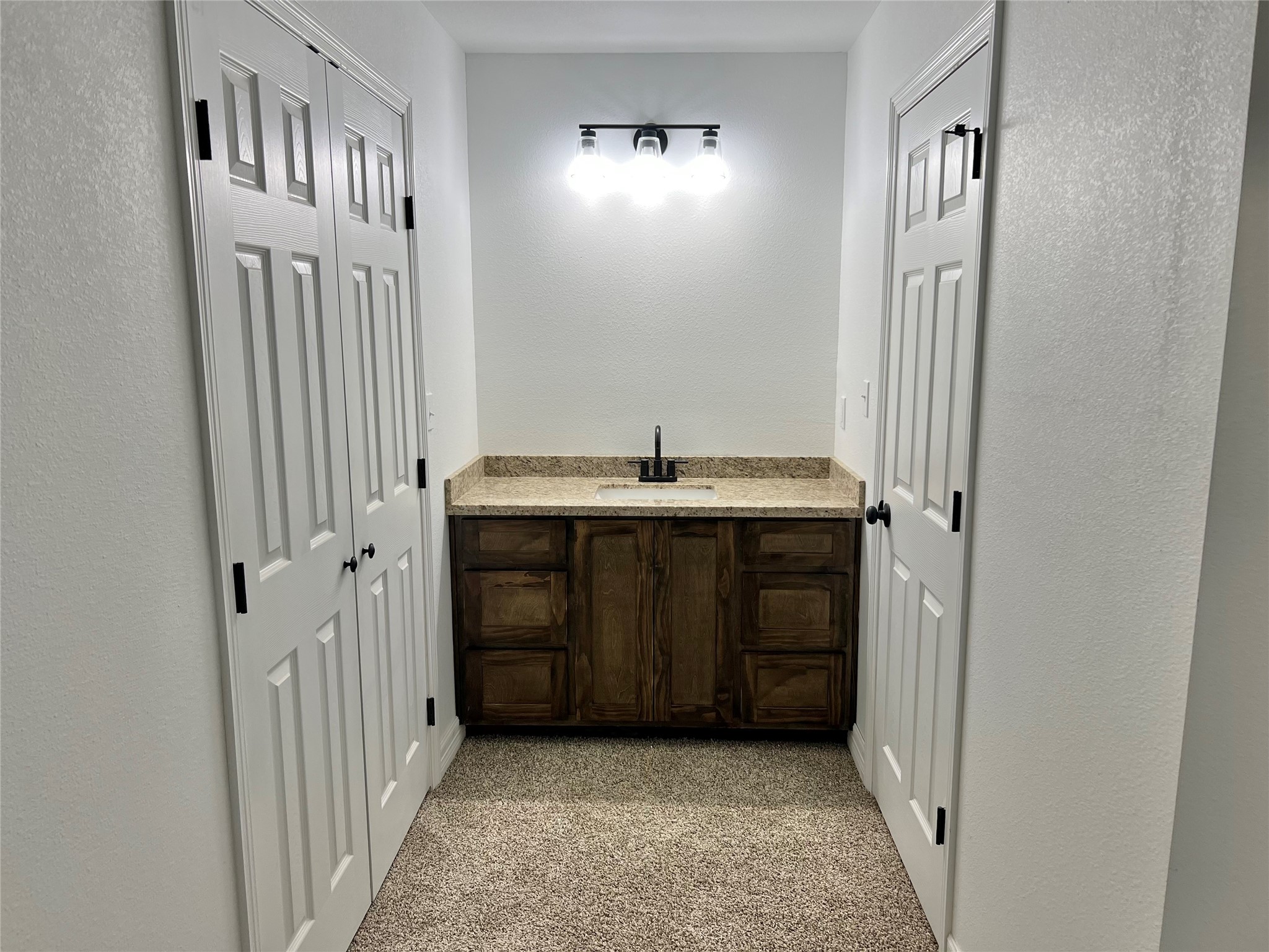 5 Colony Drive Angleton, TX 77515 - Photo 8 of 34 a bathroom with a sink and a mirror