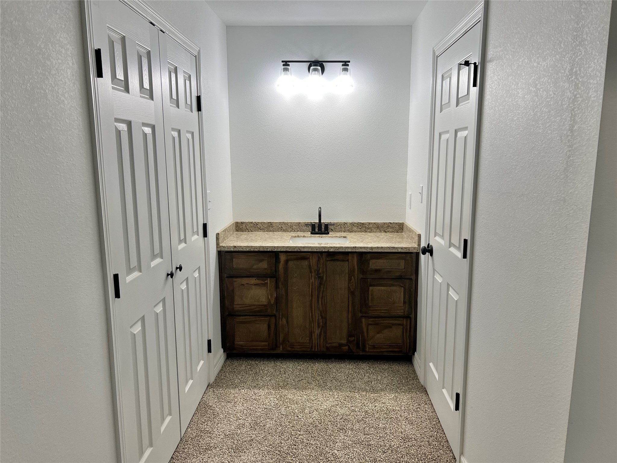 5 Colony Drive Angleton, TX 77515 - Photo 8 of 34 a bathroom with a sink and a mirror