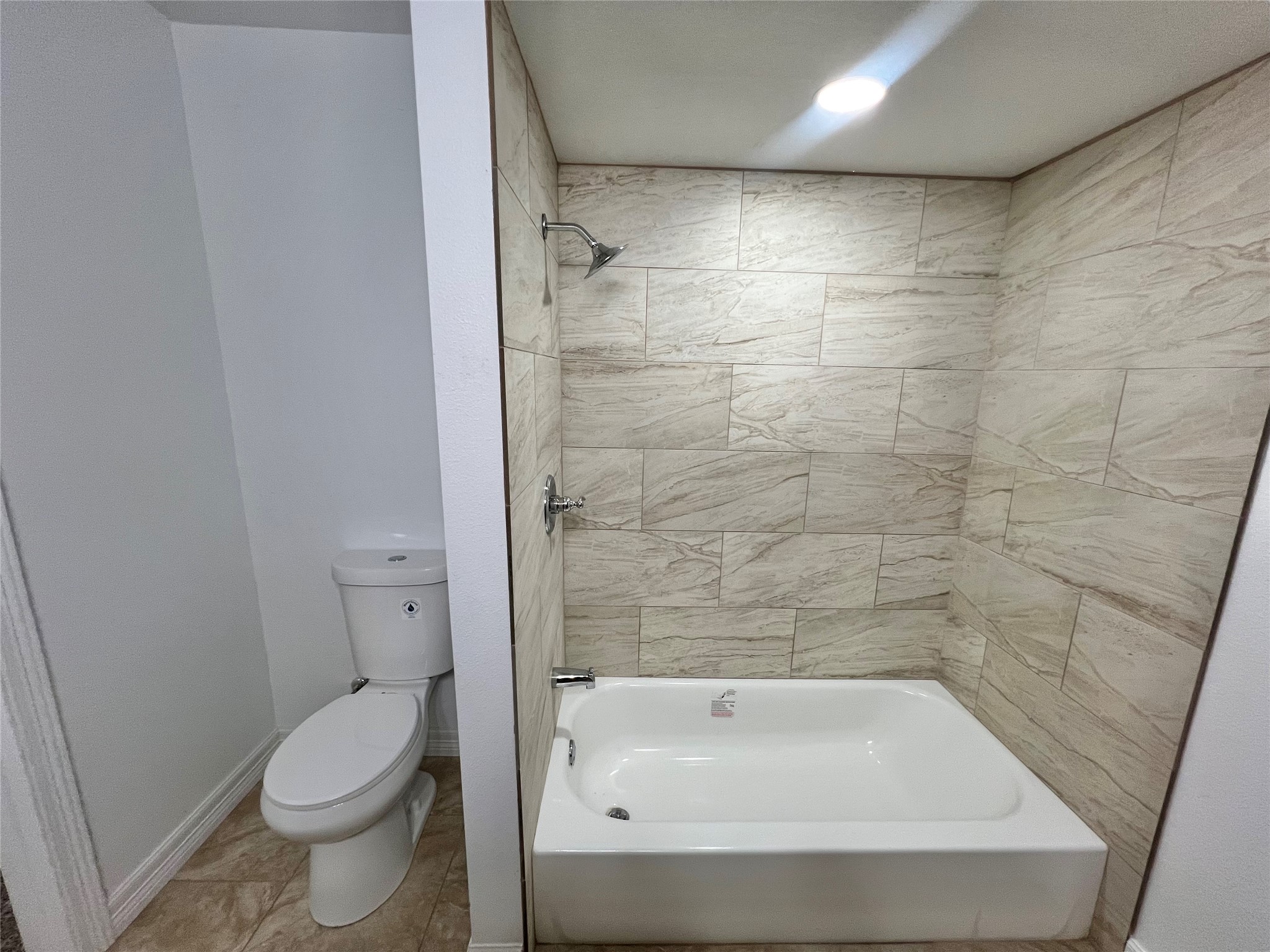 5 Colony Drive Angleton, TX 77515 - Photo 10 of 34 a bathroom with a bathtub and a toilet