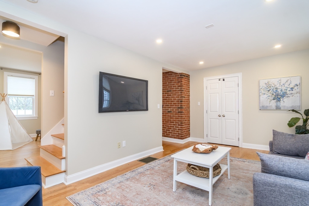 4 Willow Street Natick, MA 01760 - Photo 13 of 24 a living room with furniture and a window