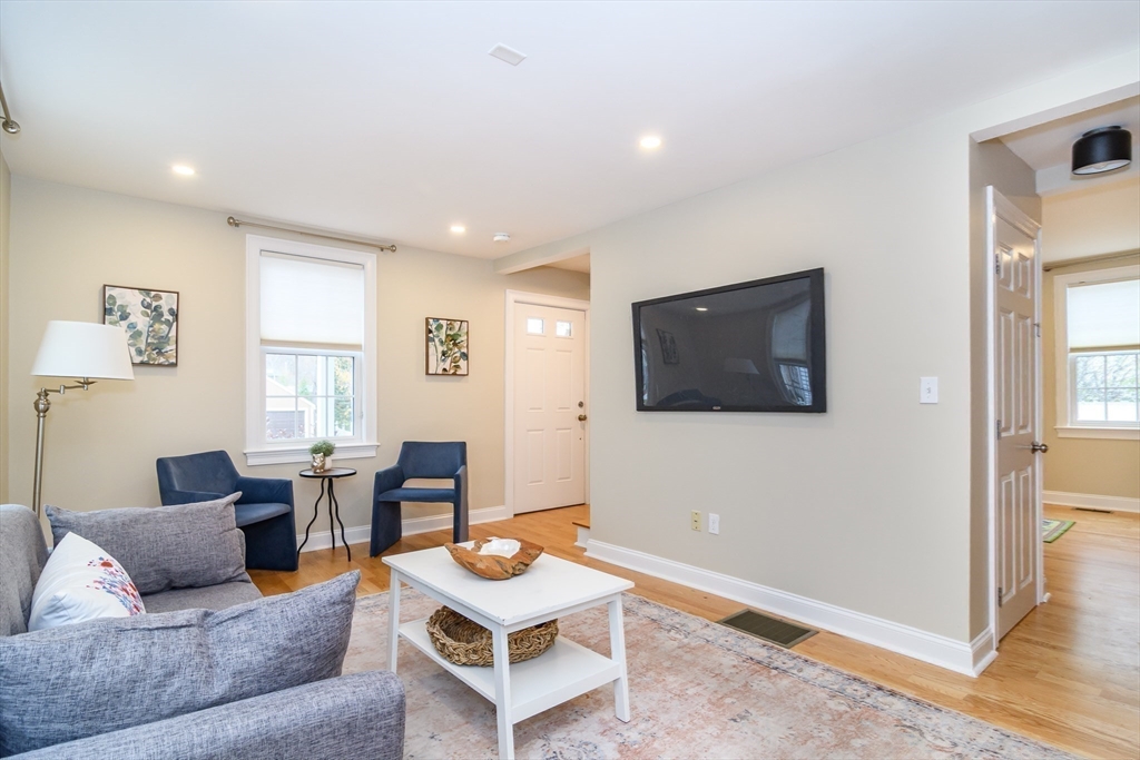 4 Willow Street Natick, MA 01760 - Photo 15 of 24 a living room with furniture and a flat screen tv