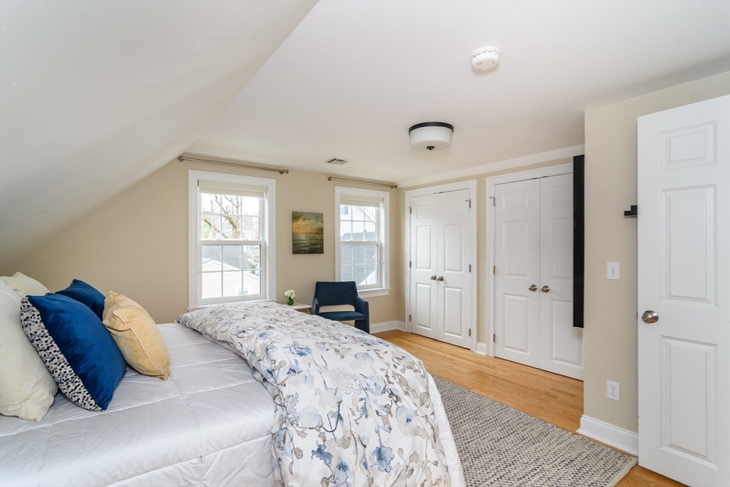 4 Willow Street Natick, MA 01760 - Photo 17 of 24 a bedroom with a bed and a window