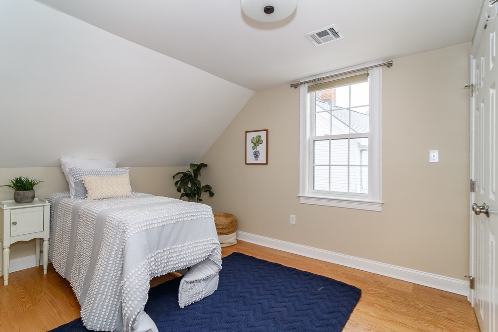 4 Willow Street Natick, MA 01760 - Photo 19 of 24 a bedroom with a bed and a window