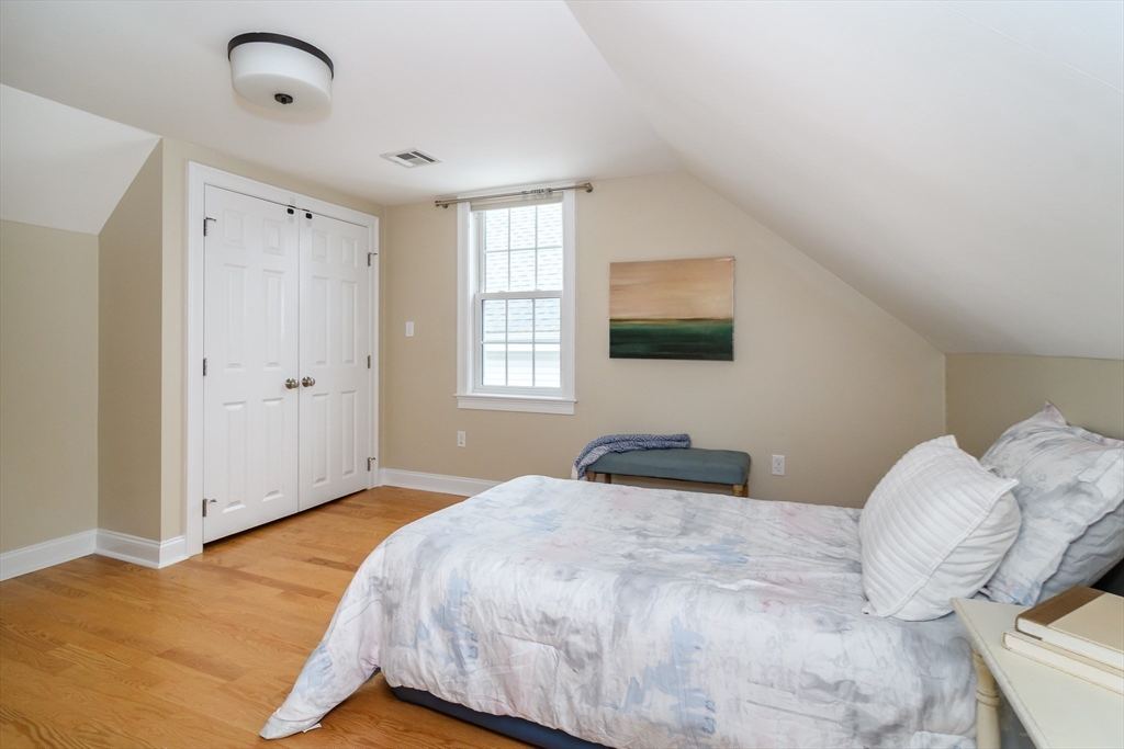 4 Willow Street Natick, MA 01760 - Photo 20 of 24 a bedroom with a bed and a flat screen tv