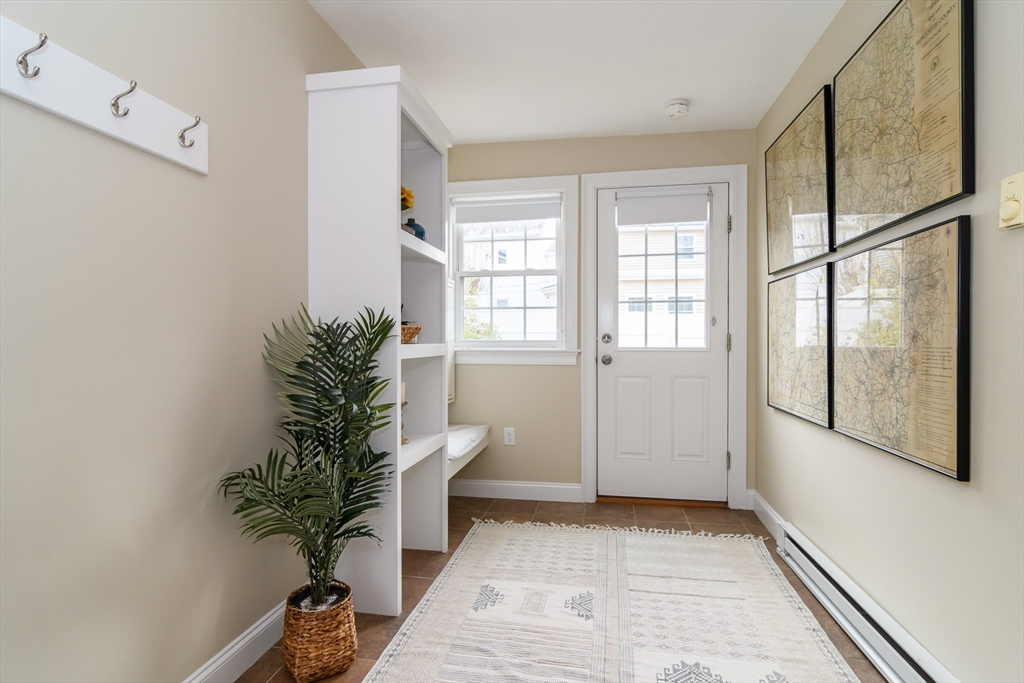 4 Willow Street Natick, MA 01760 - Photo 2 of 24 a room with potted plants and a table