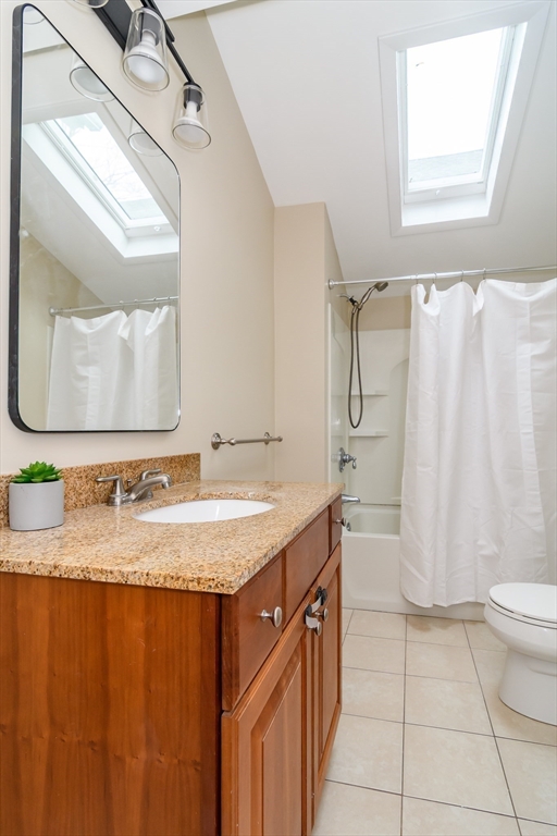 4 Willow Street Natick, MA 01760 - Photo 7 of 24 a bathroom with a granite countertop sink and a mirror
