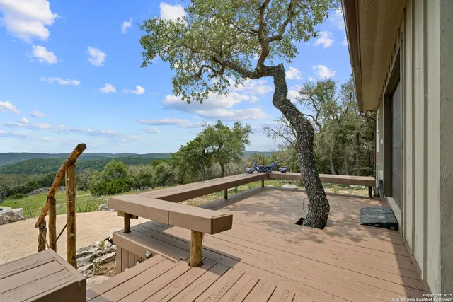 a view of a terrace with wooden floor and bench