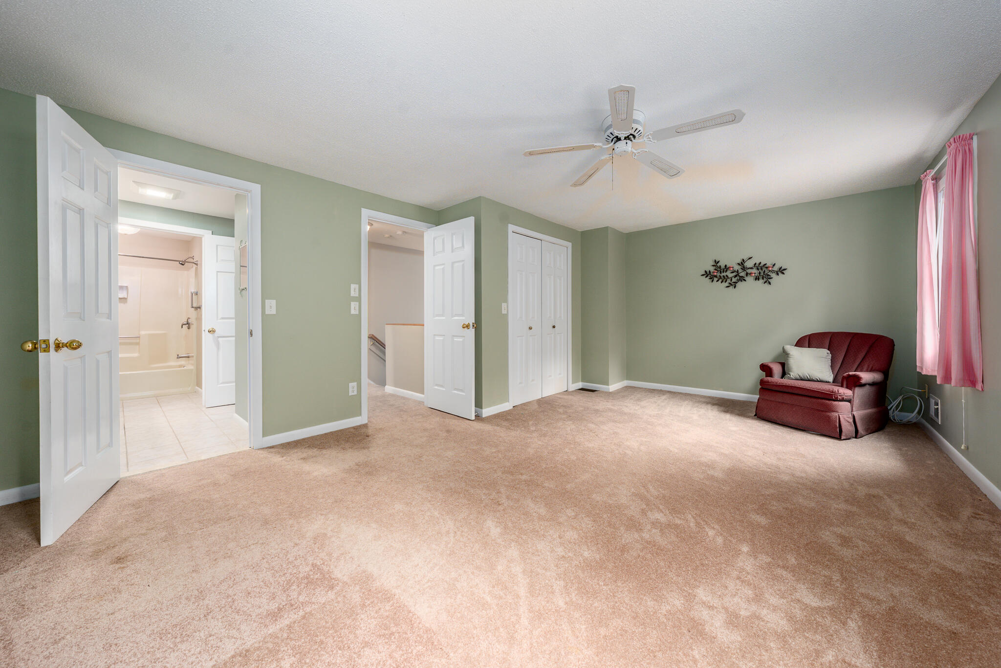 121 Shellback Way, Unit 121 Mashpee, MA 02649 - Photo 16 of 23 a view of a livingroom with furniture and a ceiling fan