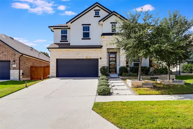 a front view of a house with swimming pool