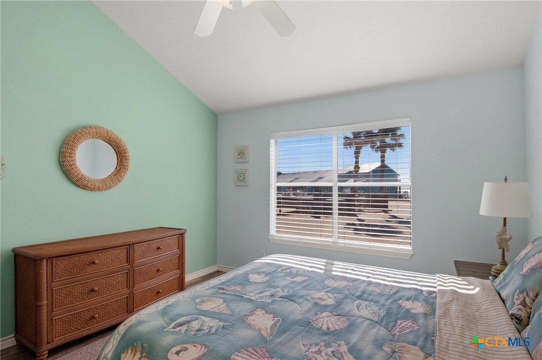 2292 North Fulton Beach Road, Unit 505 Rockport, TX 78382 - Photo 17 of 46 a bedroom with a bed and a window