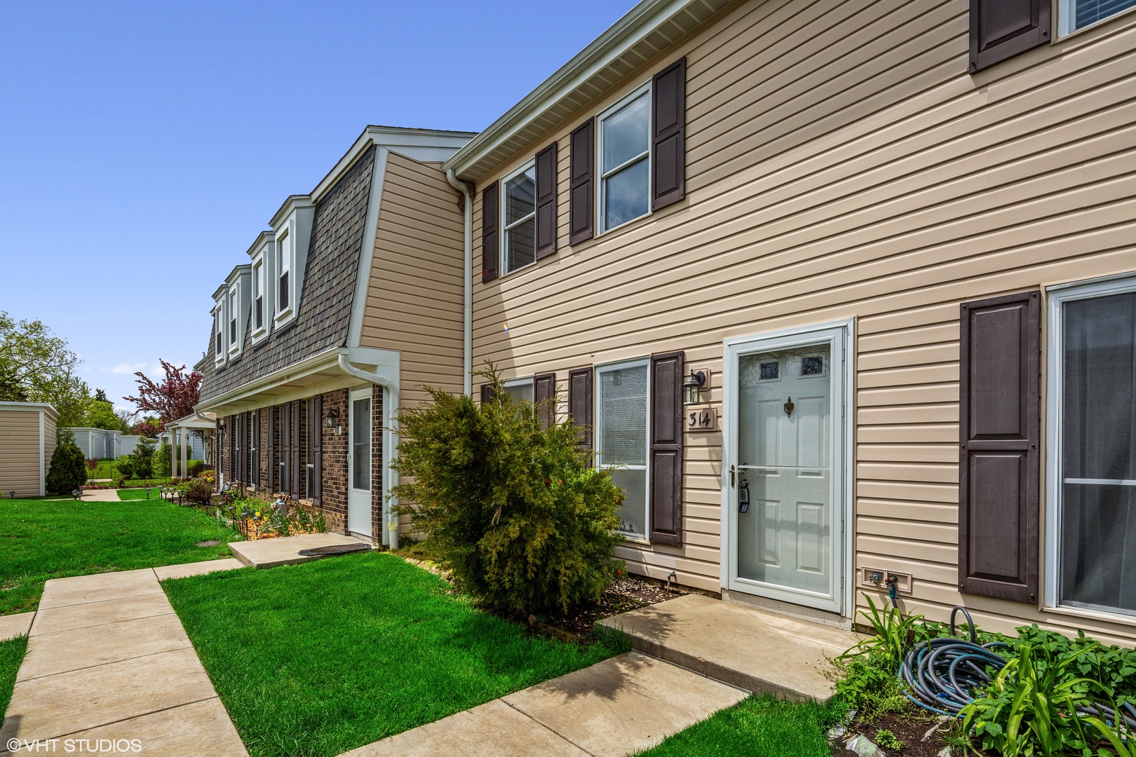 a front view of a house with a yard