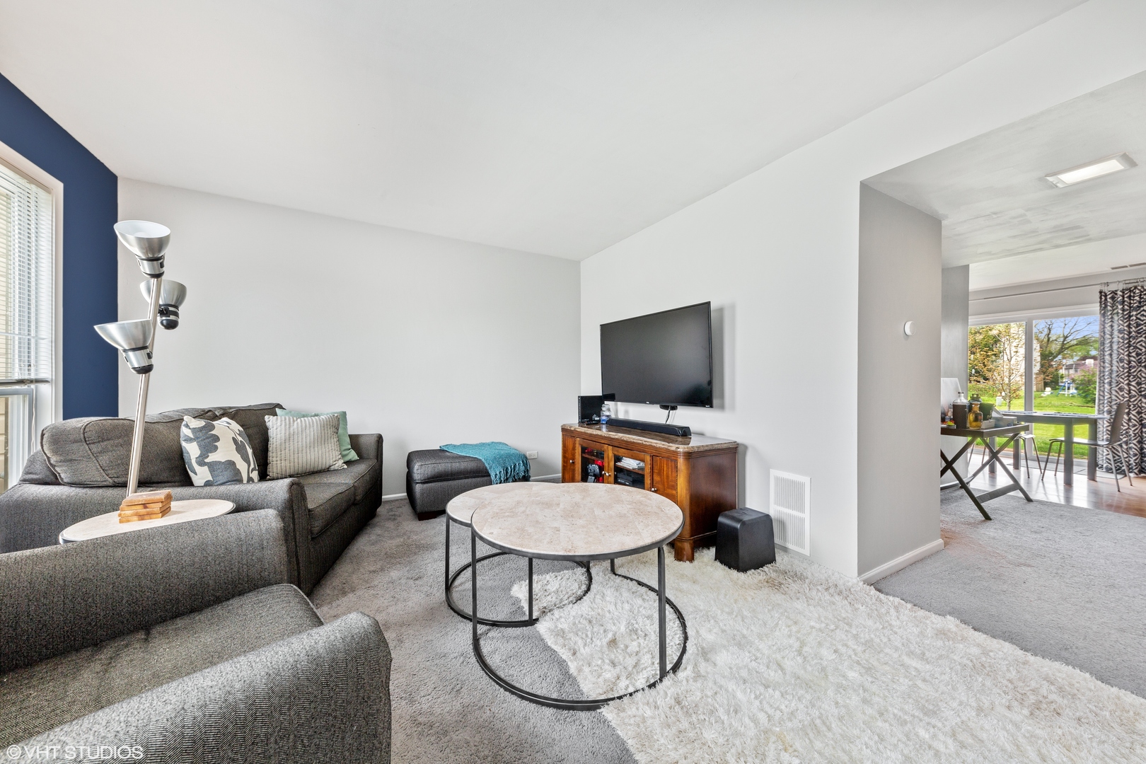 314 Rodenburg Road Roselle, IL 60172 - Photo 3 of 13 a living room with furniture and a flat screen tv