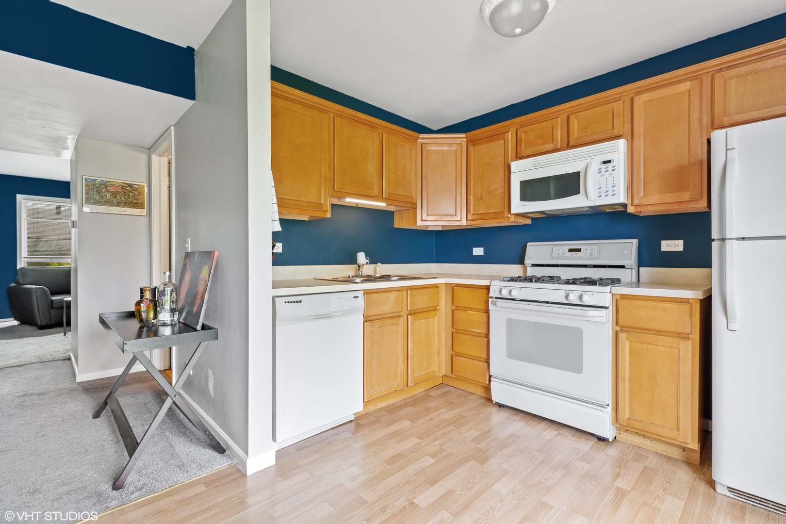314 Rodenburg Road Roselle, IL 60172 - Photo 4 of 13 a kitchen with white cabinets and white appliances