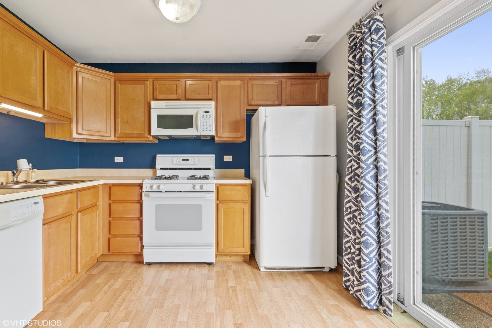 314 Rodenburg Road Roselle, IL 60172 - Photo 5 of 13 a kitchen with a refrigerator sink and cabinets