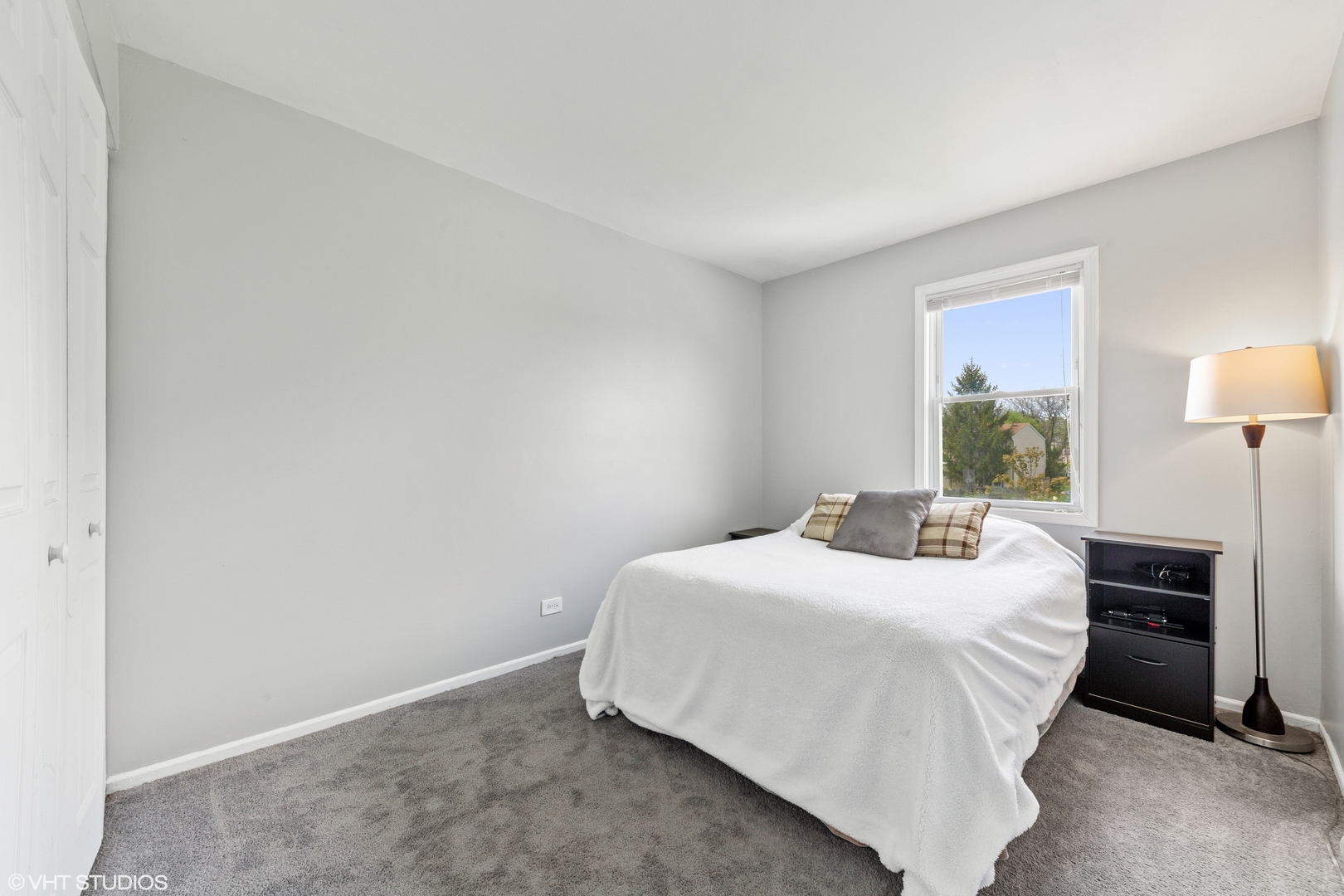 314 Rodenburg Road Roselle, IL 60172 - Photo 8 of 13 a bedroom with a bed and a window