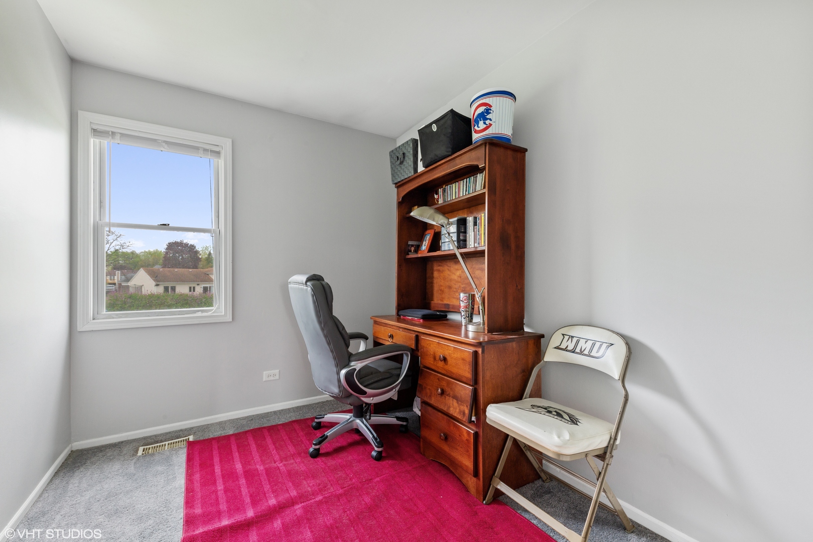 314 Rodenburg Road Roselle, IL 60172 - Photo 9 of 13 a living room with furniture a rug and a window