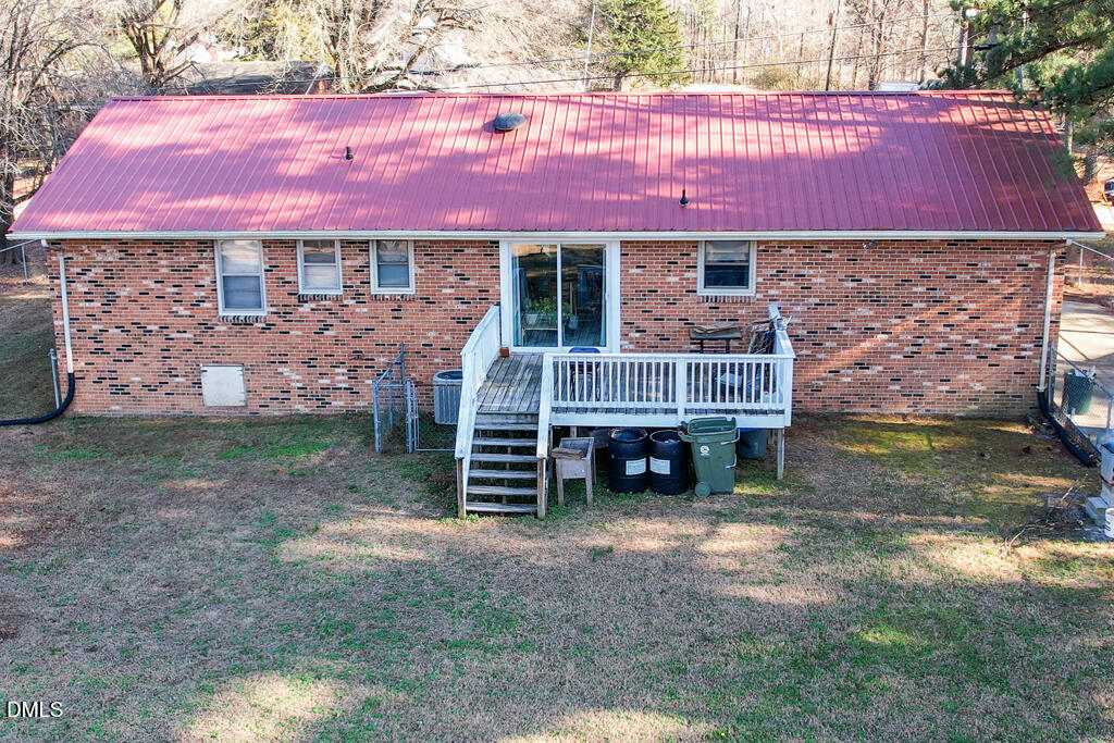 1727 Pinecrest Road Henderson, NC 27536 - Photo 14 of 14 a view of a house with a yard and sitting area