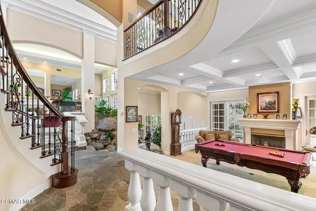 a view of a livingroom with furniture and a window
