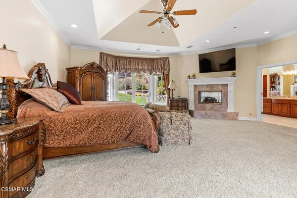 a room with pool table and windows