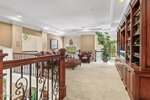 a front view of building with yard swimming pool and outdoor seating