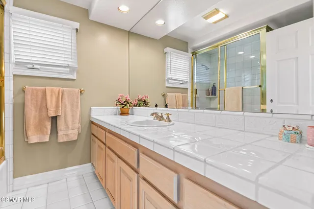 a view of a house with swimming pool and porch with furniture