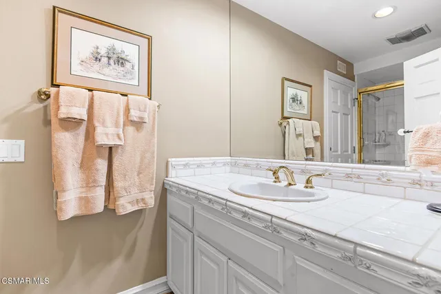 a view of a house with a yard and lake view