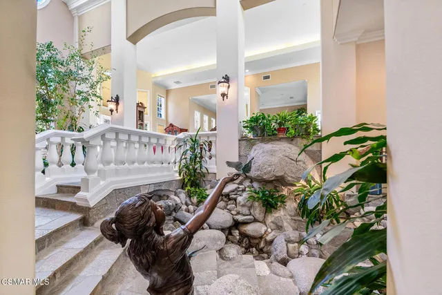 a kitchen with stainless steel appliances granite countertop a stove and a refrigerator