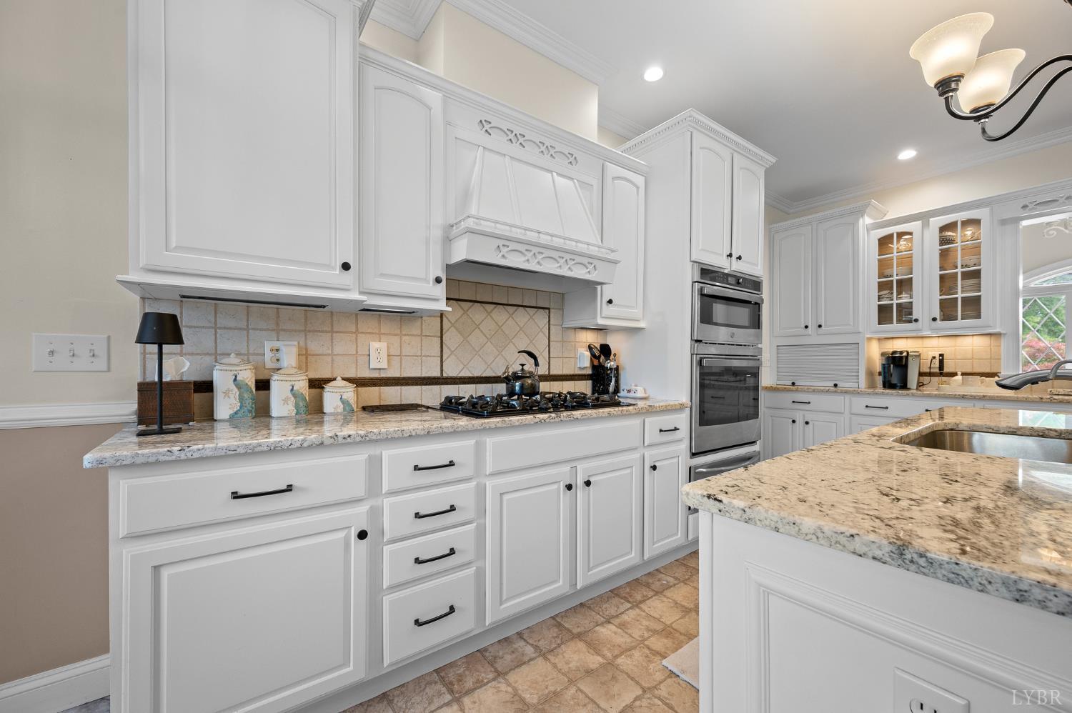 200 North Branch Road Bedford, VA 24523 - Photo 12 of 52 a kitchen with granite countertop white cabinets and stainless steel appliances