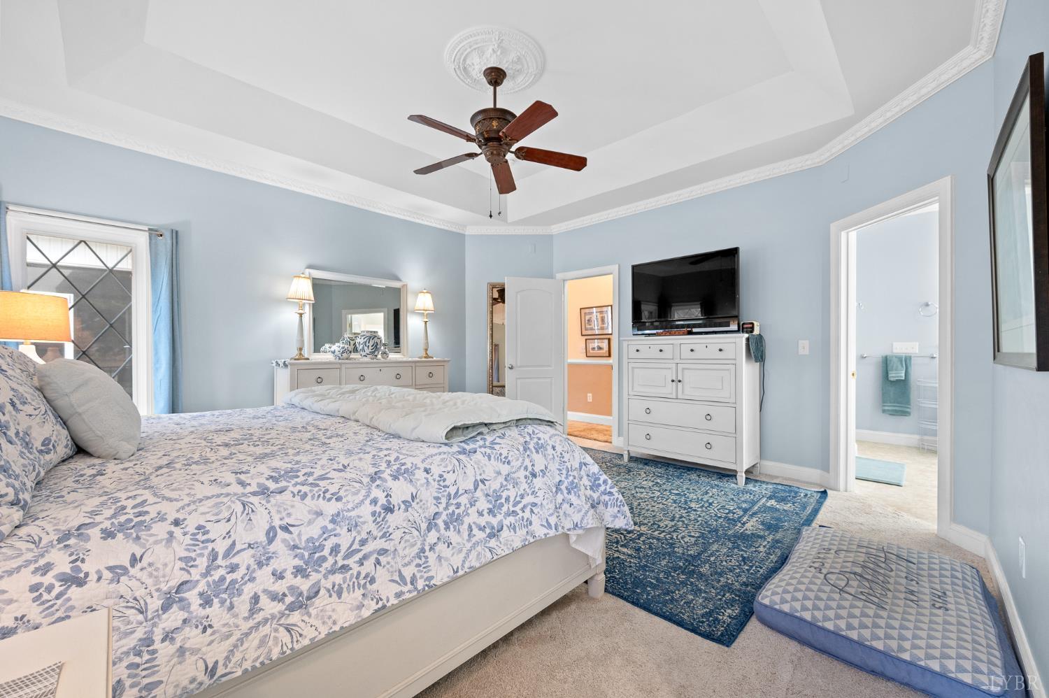 200 North Branch Road Bedford, VA 24523 - Photo 18 of 52 a bedroom with a bed a mirror on dresser and a flat screen tv