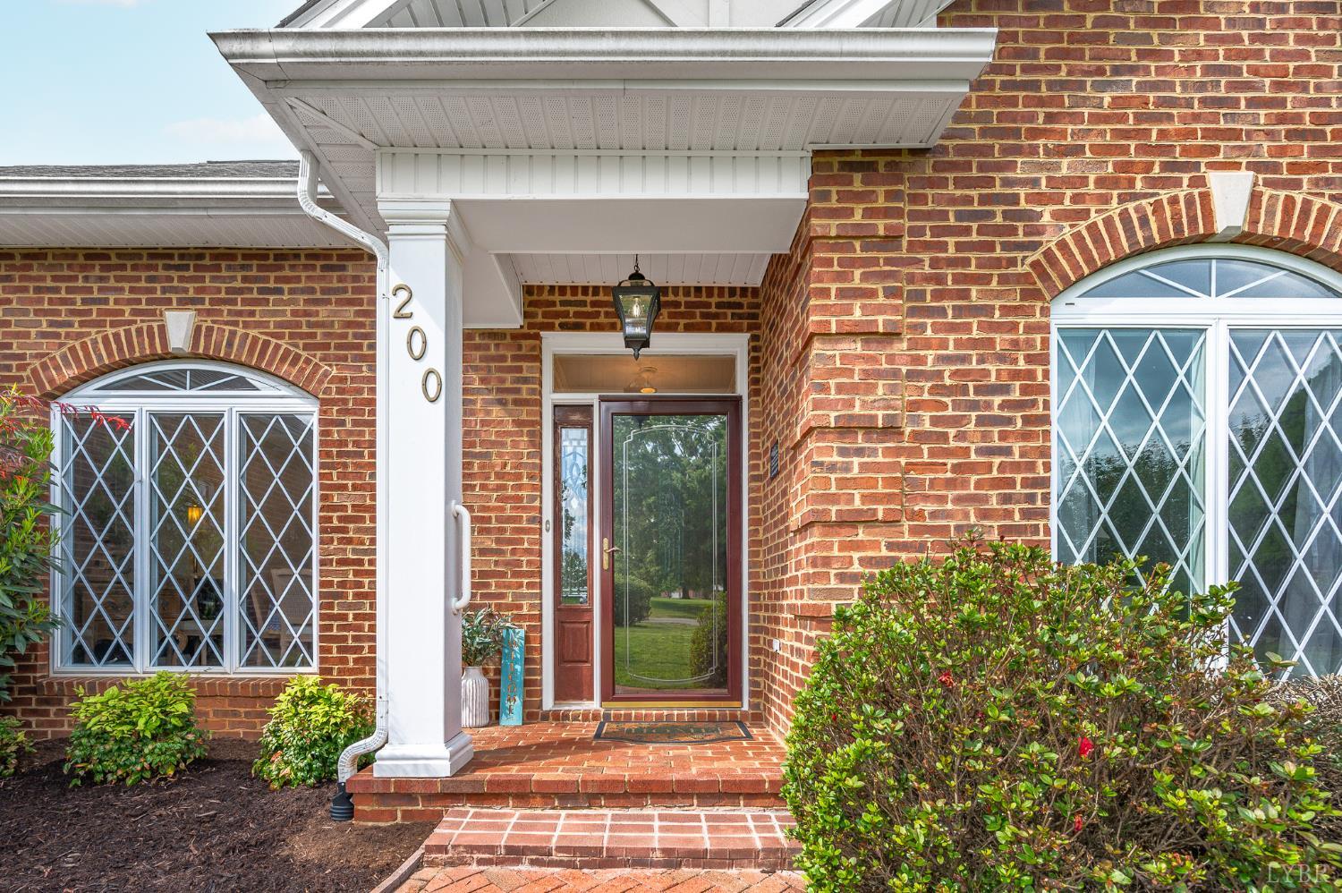 200 North Branch Road Bedford, VA 24523 - Photo 2 of 52 a front view of a house with a garden