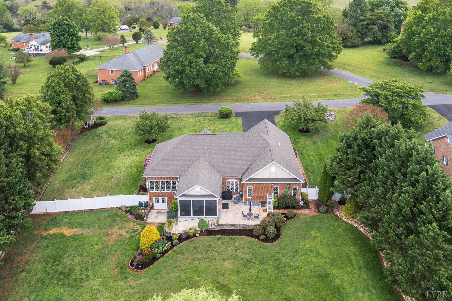 200 North Branch Road Bedford, VA 24523 - Photo 40 of 52 an aerial view of a house with swimming pool patio and lake view