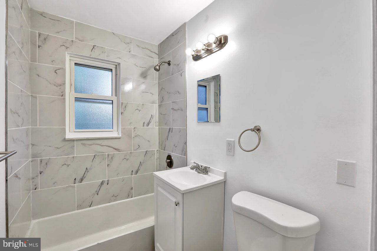 331 Oakland Street Ewing, NJ 08618 - Photo 11 of 21 a bathroom with a sink a toilet and shower