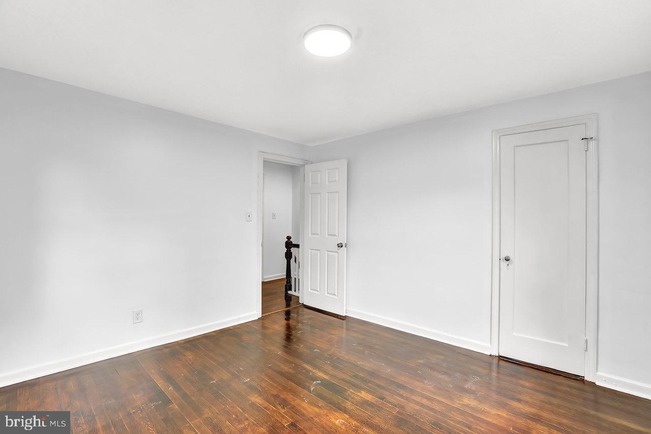 331 Oakland Street Ewing, NJ 08618 - Photo 18 of 21 a view of an empty room and wooden floor