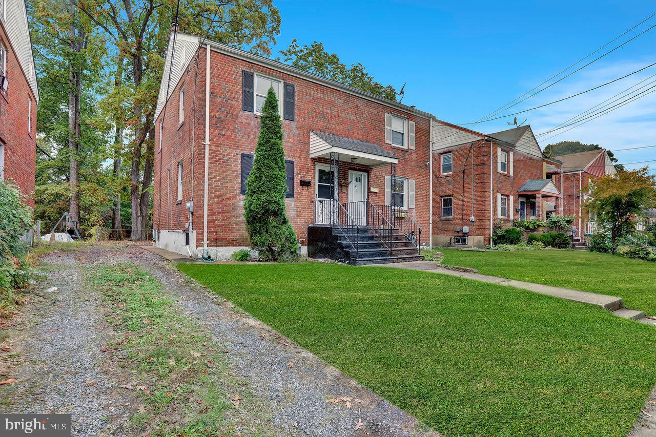 331 Oakland Street Ewing, NJ 08618 - Photo 3 of 21 a front view of house with yard and green space