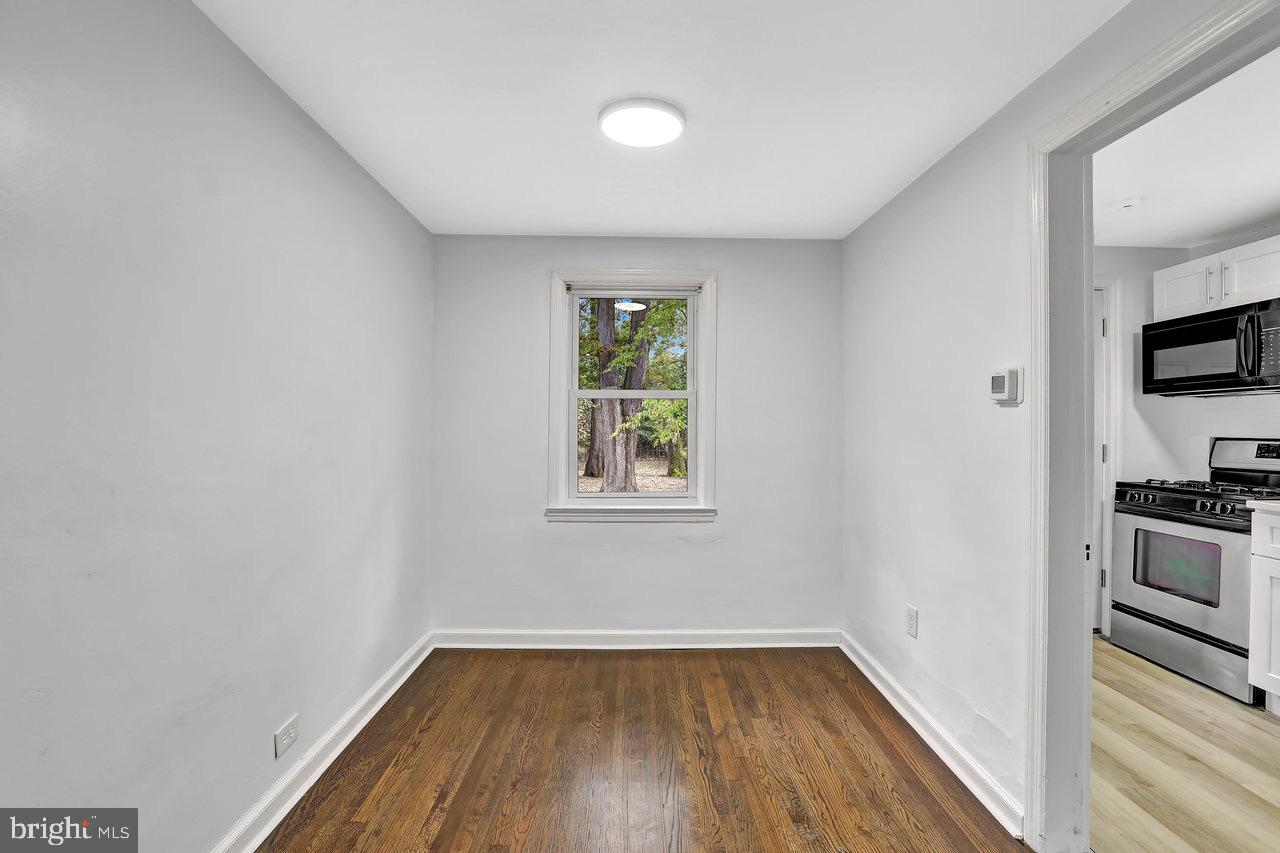 331 Oakland Street Ewing, NJ 08618 - Photo 6 of 21 a view of a livingroom with wooden floor and a window