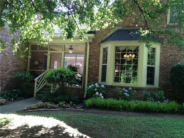 3301 Wimbledon Road Nashville, TN 37215 - Photo 2 of 9 Bay window is in the large breakfast area featuring built-in cabinets, gas log fireplace. Friends and family always come to the side entrance and sit on the screen porch for a visit.