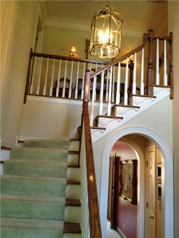 3301 Wimbledon Road Nashville, TN 37215 - Photo 3 of 9 A beautiful entry foyer well lit from the center dormer window; note the deep trims on the stair way and double arch passage leading back to the Family Room.