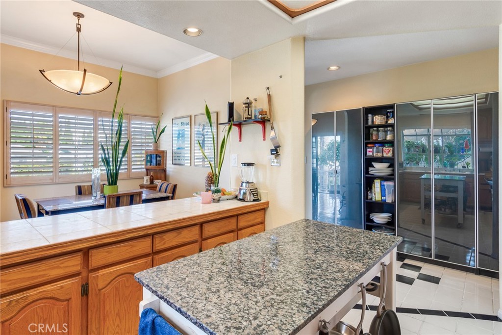 4220 Toland Way Los Angeles, CA 90065 - Photo 15 of 49 a kitchen with stainless steel appliances granite countertop a stove and more cabinets