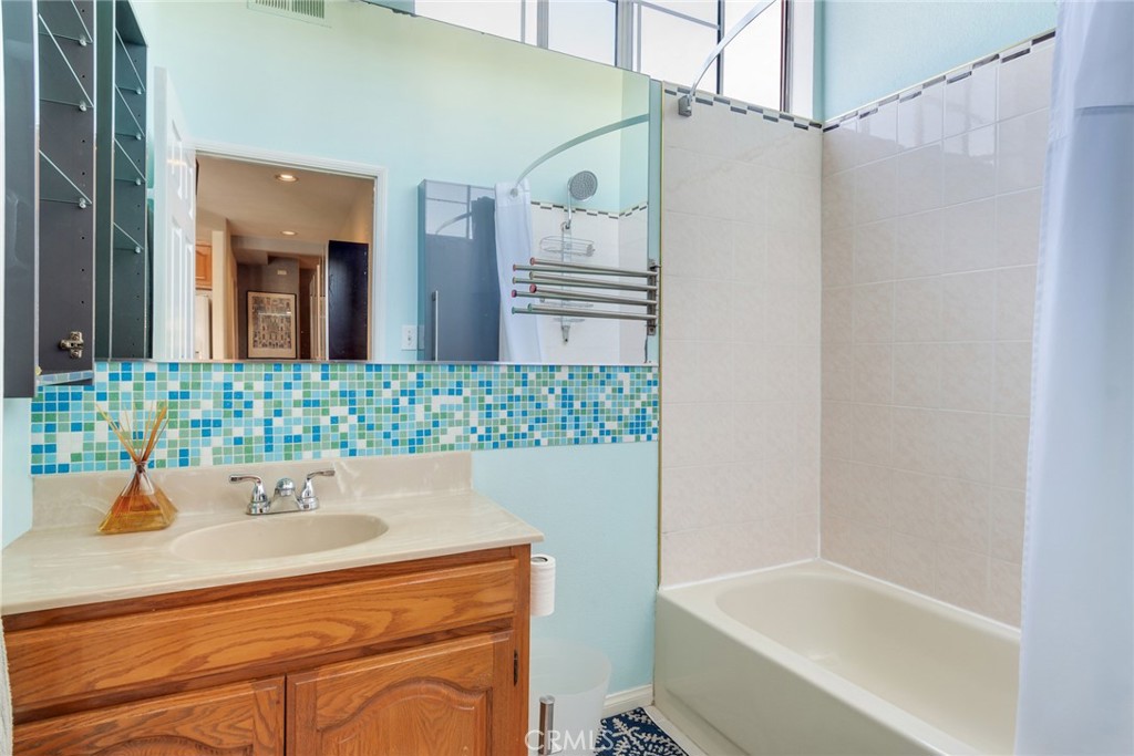 4220 Toland Way Los Angeles, CA 90065 - Photo 18 of 49 a bathroom with a sink and a bathtub