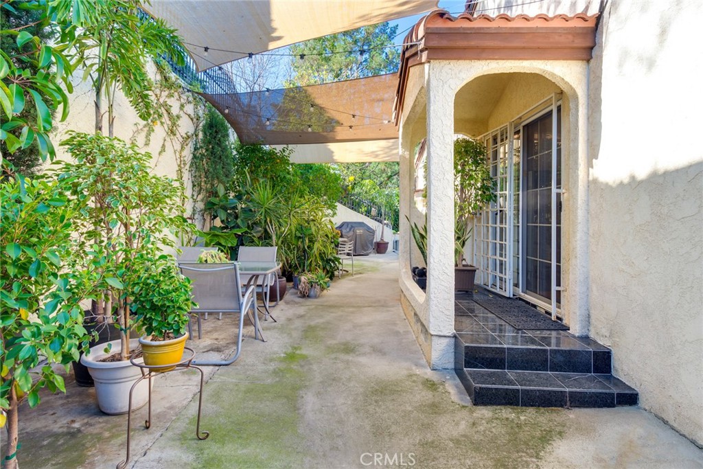 4220 Toland Way Los Angeles, CA 90065 - Photo 19 of 49 a view of a house with sitting area and garden