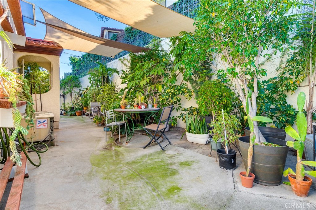 4220 Toland Way Los Angeles, CA 90065 - Photo 21 of 49 a view of a patio with a table and chairs under an umbrella