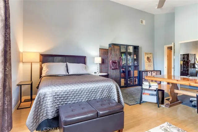 a bathroom with a granite countertop sink and a large mirror