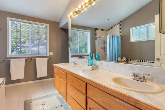 a bathroom with a tub and a shower