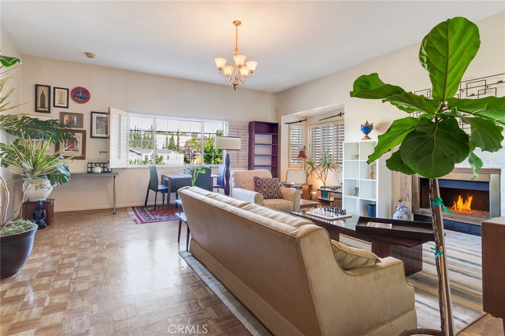 4220 Toland Way Los Angeles, CA 90065 - Photo 3 of 49 a living room with furniture a potted plant and a chandelier