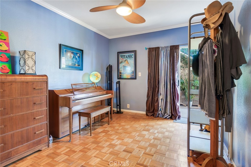 4220 Toland Way Los Angeles, CA 90065 - Photo 31 of 49 a bedroom with a bed and a chandelier