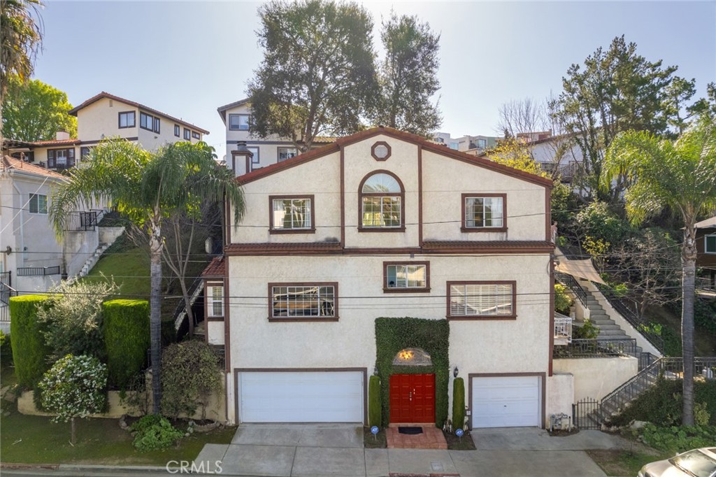 4220 Toland Way Los Angeles, CA 90065 - Photo 44 of 49 a front view of a house with garden