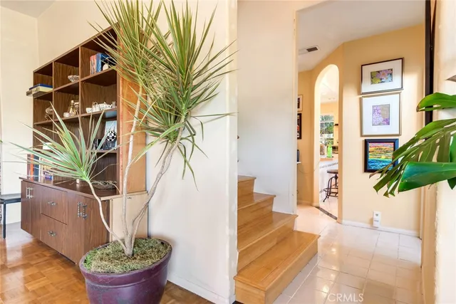 a view of entryway with paintings on the wall