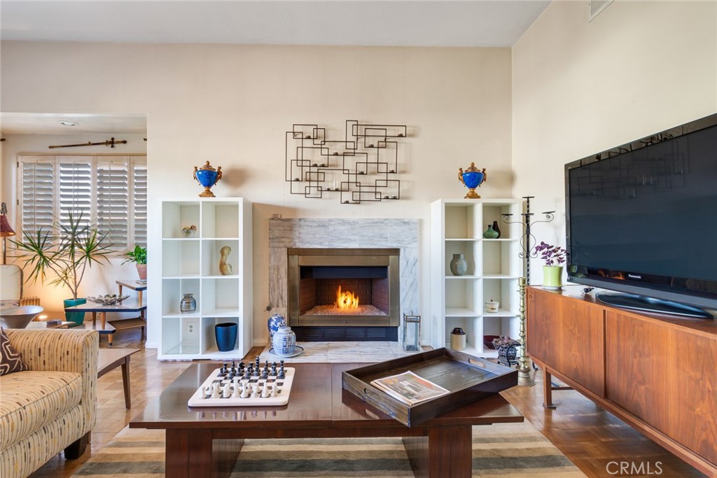 4220 Toland Way Los Angeles, CA 90065 - Photo 7 of 49 a living room with furniture a flat screen tv and a fireplace